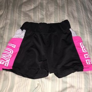 black and pink athletic shorts.